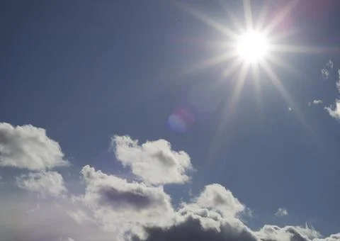 Sky with clouds and sun Stock Photos