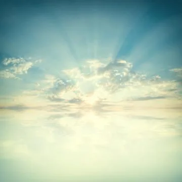 Sky with clouds and sun reflection in water Stock Photos