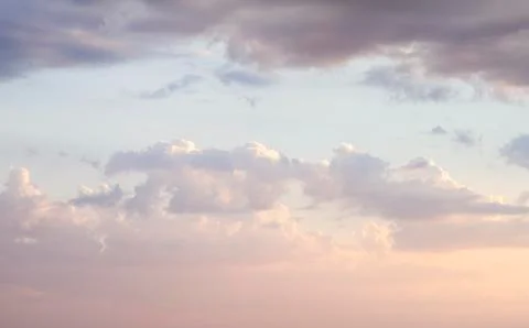 Sky with clouds and sunlight at sunset. colorful and cheerful, wallpaper or t Stock Photos