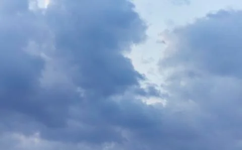 Sky with clouds and sunlight at sunset. colorful and cheerful, wallpaper or t Stock Photos