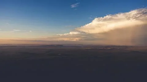 Sky with clouds and sunset over open land Stock Photos