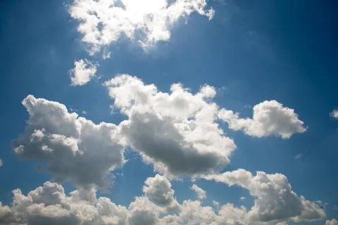 Sky clouds on a background of bright blue clear sky Stock Photos