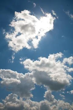 Sky clouds on a background of bright blue clear sky Stock Photos