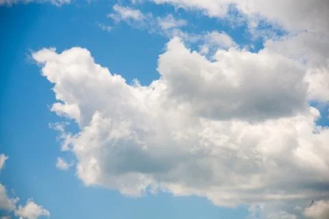 Sky clouds on a background of bright blue clear sky Stock Photos