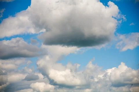 Sky clouds on a background of bright blue clear sky Stock Photos