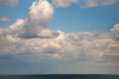 Sky clouds on a background of bright blue clear sky Stock Photos