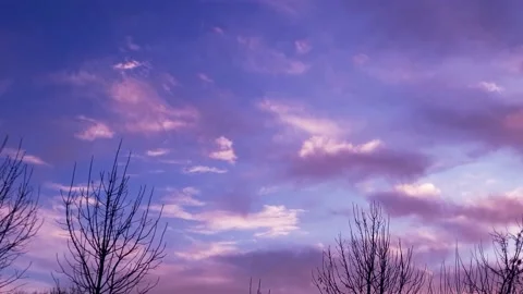 Sky with clouds at dawn, gently purple sunrise Stock Footage 166373636