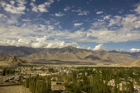 Sky with clouds during the day over the city in the mountains Stock Photos