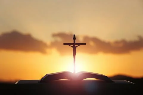The sky, the clouds, the light, the cross of Jesus Christ, and the Bible Fotos de archivo