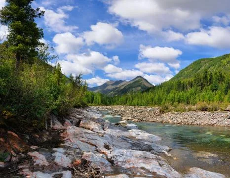 Sky with clouds over the mountain river Stock Photos