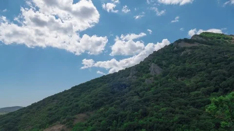Sky with clouds over mountains, time lapse Stock Footage 79415748