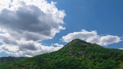 Sky with clouds over mountains, time lapse Stock Footage 79415902