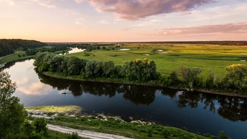 Sky, clouds over the river between the forest and the field, evening, boat Vídeo Stock 77267479