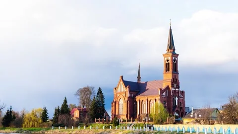 Sky with clouds passing by over catholic church Stock Footage 153223270