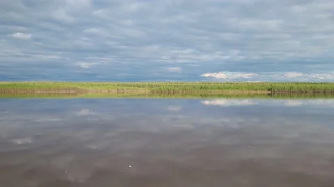 The sky with clouds is reflected in the river Stock-Footage 195214816