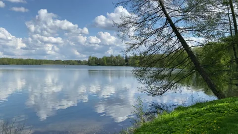 Sky with clouds reflecting in Galve lake in Trakai, Lithuania Stock Footage 154266654