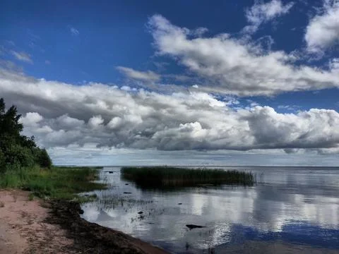 Sky, clouds, shore 2 Stock Photos