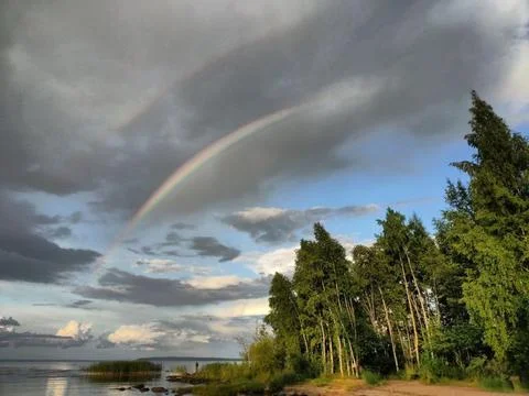 Sky, clouds, shore, rainbow 2 Stock Photos