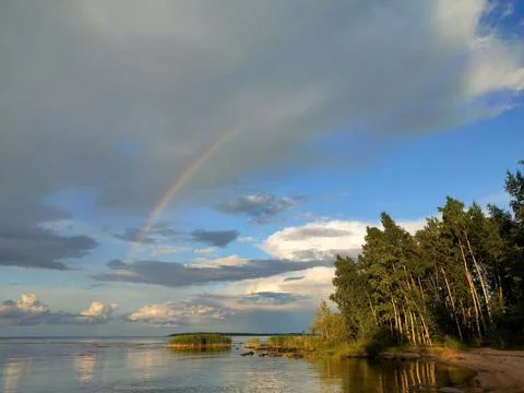 Sky, clouds, shore, rainbow 3 Stock Photos