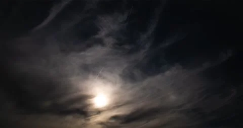 Sky with clouds that soften the sun with jet planes leaving a graceful contrails Stock Footage 289481190