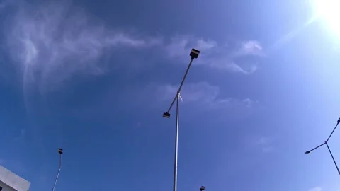 Sky, clouds, sun, lamppost. time lapse 動画素材 341839962