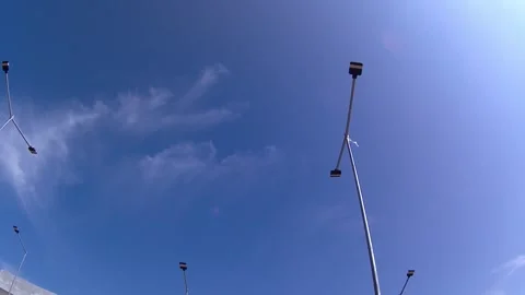 Sky, clouds, sun, sun rays. lamppost. time lapse Stockbeeldmateriaal 341839961