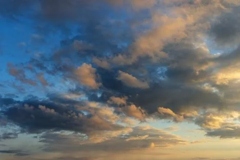 Sky with clouds at sunset, background Stock Photos