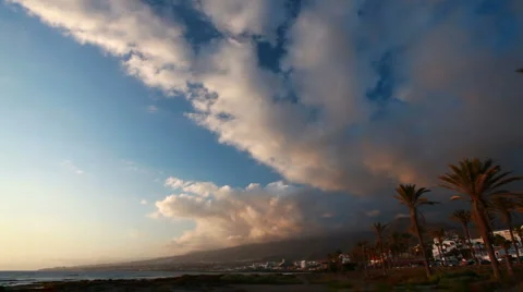 Sky clouds at sunset, ocean, mountain - beach resort town Stock Footage 6531541