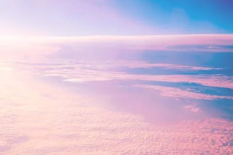Sky with clouds at sunset or dawn, pink and blue color, clouds, natural backg Stock Photos