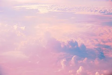 Sky with clouds at sunset or dawn, pink and blue color, clouds, natural backg Stock Photos