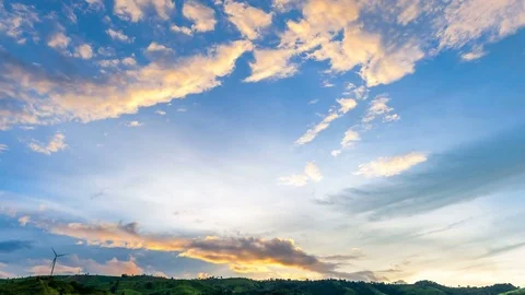 Sky clouds sunset over mountain with wind turbine, 4k timelapse Stock Footage 79824143