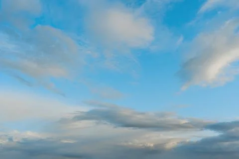 Sky with clouds at sunset, soft sunlight Stock Photos