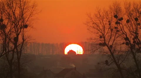 The sky with clouds at sunset - taymlaps. Sunset in the field behind the trees. Stock-Footage 58591093