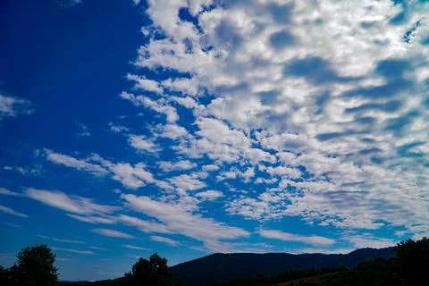 Sky in clouds, white clouds, blue sky noon sky, clouds over the mountains Stock Photos