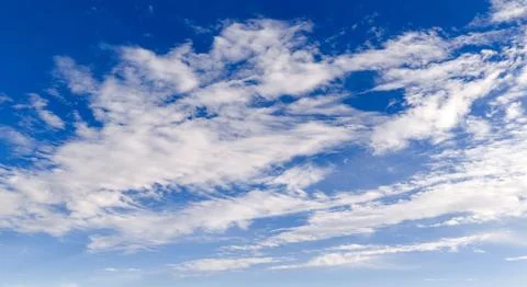 Sky cloudscape background blue. Bright sky with soft clouds texture. Daytim.. Stock-Fotos
