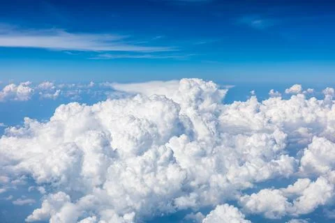 Sky cloudscape.Blue sky and white clouds on a sunny day.Aerial view. Stock Photos