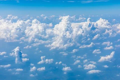 Sky cloudscape.Blue sky and white clouds on a sunny day.Aerial view. Stock Photos