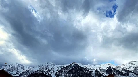 The sky is cloudy and the mountains are covered in snow 스톡 동영상 271079863