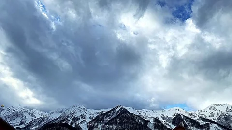 The sky is cloudy and the mountains are covered in snow 스톡 동영상 277258132