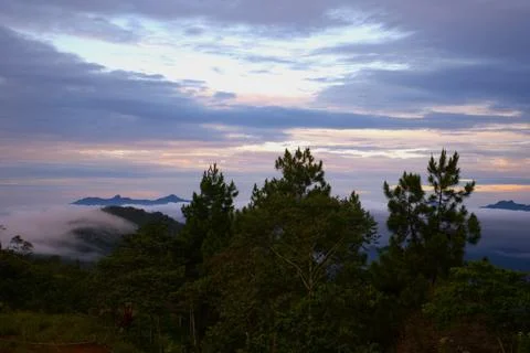 The sky is cloudy and the sun is setting Stock Photos