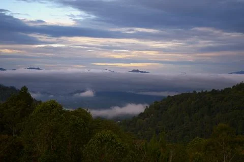 The sky is cloudy and the sun is setting Stock Photos