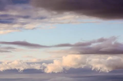 The sky is cloudy and the sun is setting Stock Photos