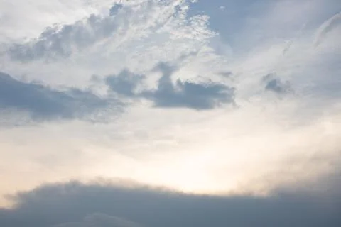 The sky is cloudy and the sun is setting Stock Photos