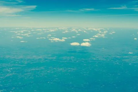 Sky on a cloudy day, the view from the plane. Stock Photos