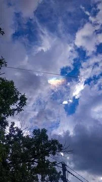 Sky covered with clouds and the rainbow appears after a rain Stock-Fotos