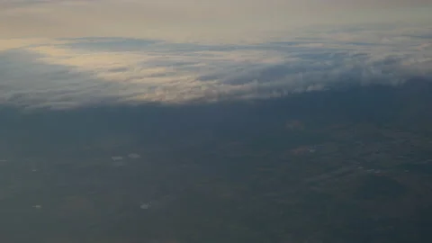 The sky is covered with clouds over the countryside of fields, in Brazil Stock Footage 231510745