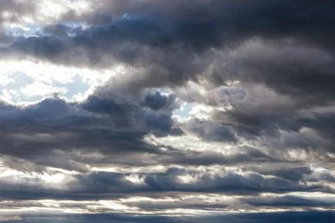 Sky covered with gray storm clouds, cumulonimbus Stock Photos