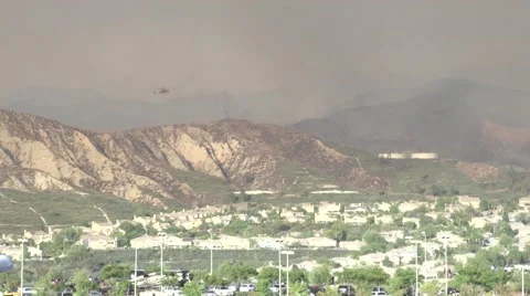 Sky Crane firefighting helicopter makes partial water drop (Sand Fire) Stock Footage 65750991