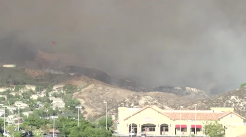 Sky Crane firefighting helicopter makes partial water drop (Sand Fire) Stock Footage 65751087