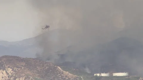Sky Crane helicopter makes multiple water drops (Sand Fire) Stock Footage 65767755